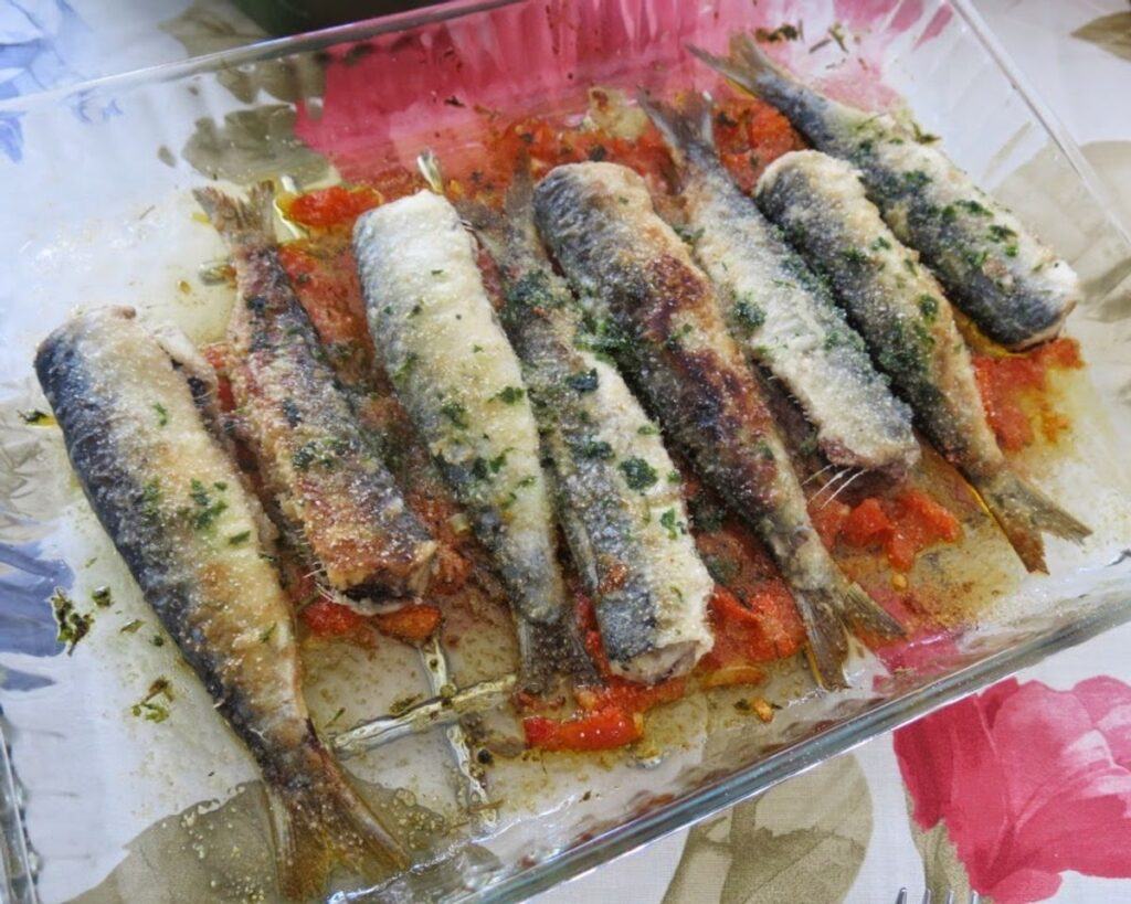 Grilled sardines on a serving board