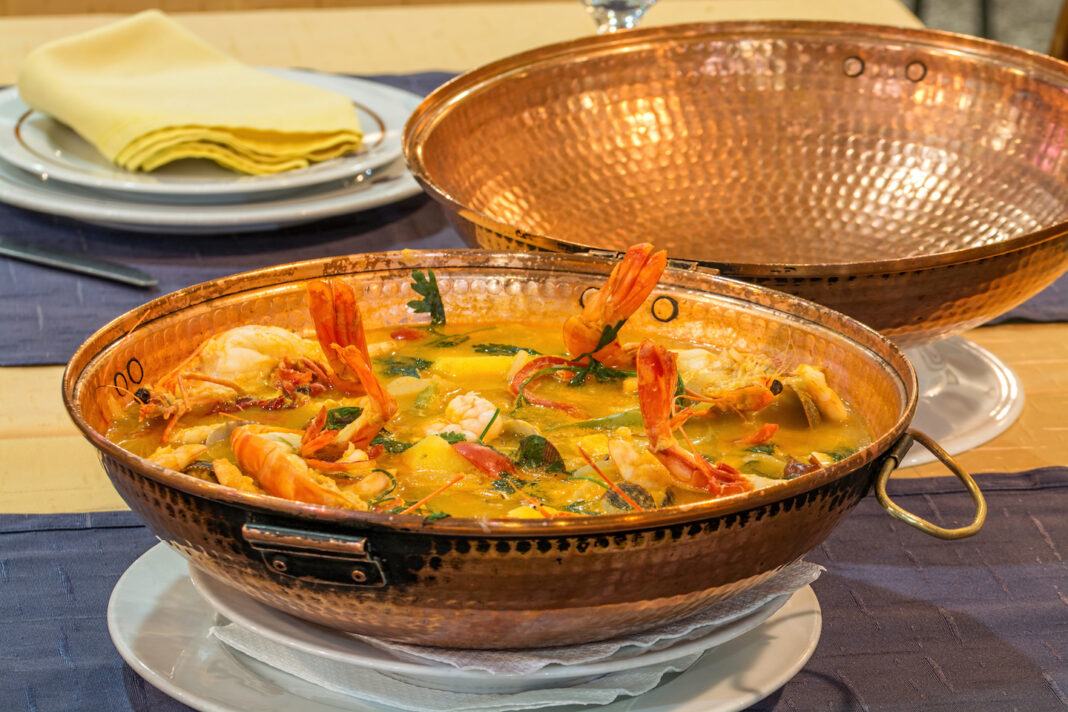 A shellfish cataplana in a traditional pot