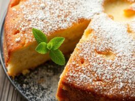 Freshly baked Portuguese Duchesse cake with powdered sugar