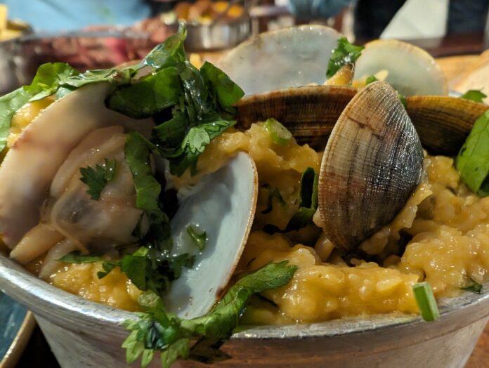 Portuguese Accorda or bread soup served with clams and coriander