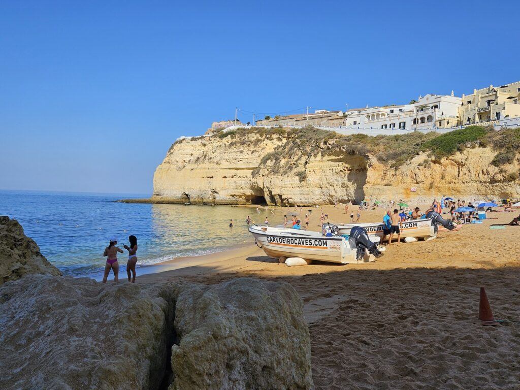 Caroiveiro beach with boats on the sand and people bathing