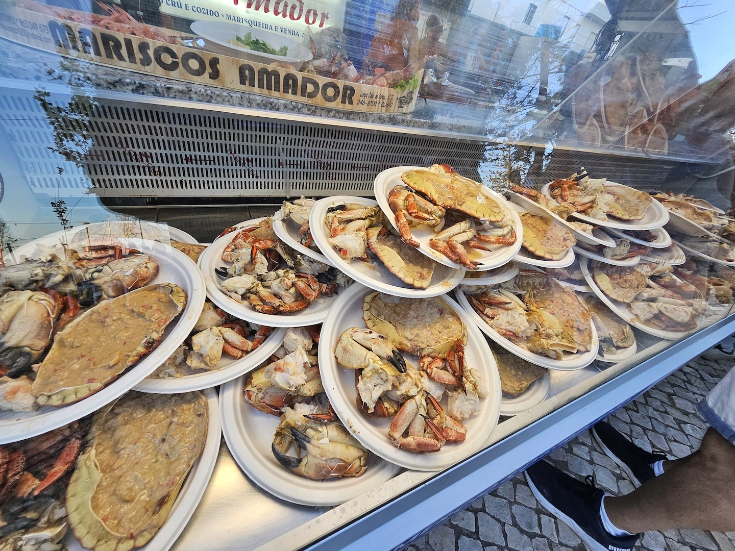 Plates of crab on a counter at a seafood festival