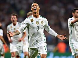 Ronaldo celebrates with teammates after scoring late goal.