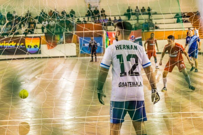 Men playing indoor football or futsal