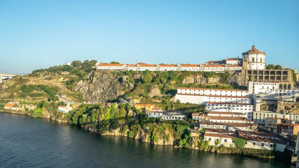 Monastery of Serra do Pilar in Porto, seen with the river flowing in front of the monastery.