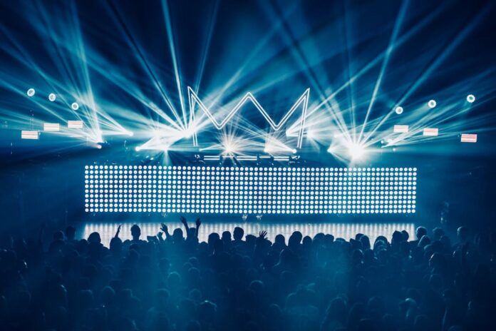 A concert stage with background lighting