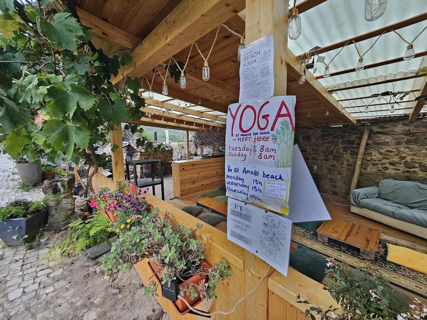 A sign advertising yoga classes an a yoga resort in Portugal