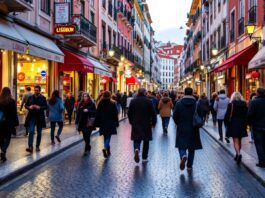 Lisbon street scene with people and shops bustling.