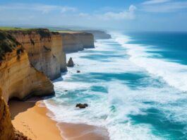 Nazare beach with surfers and massive ocean waves.