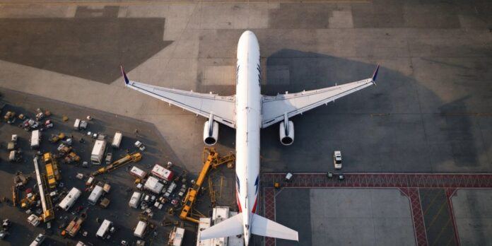 Air France plane at airport with TAP Air Portugal logo.