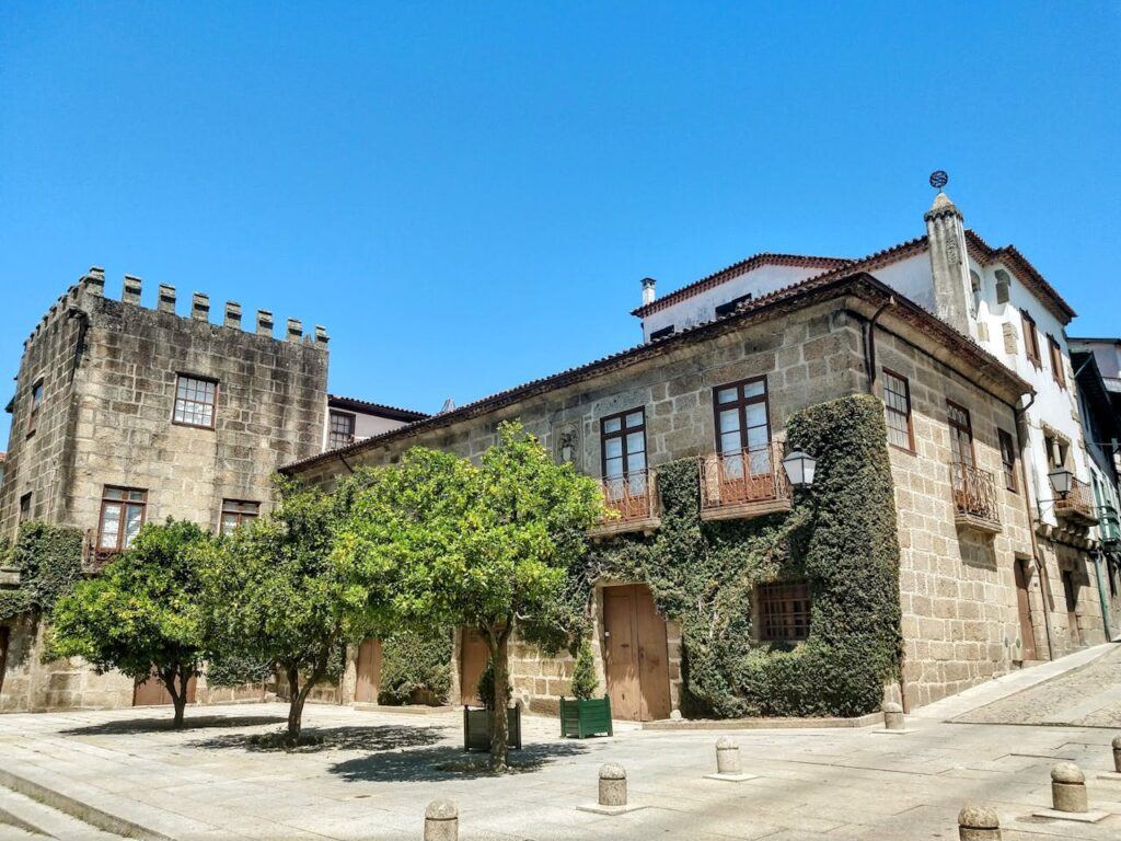 An old looking inhabited building against a blue sky in Guimarães, Braga, Portugal.