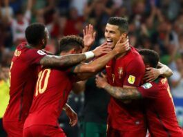 Cristiano Ronaldo celebrating a goal with teammates.