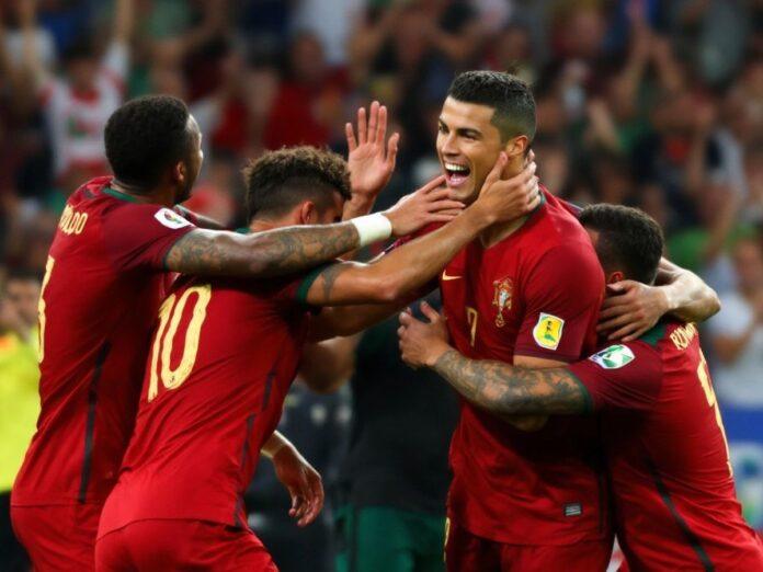 Cristiano Ronaldo celebrating a goal with teammates.