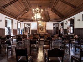 Palácio da Independência interior with chairs arranged as if for a conference or address.