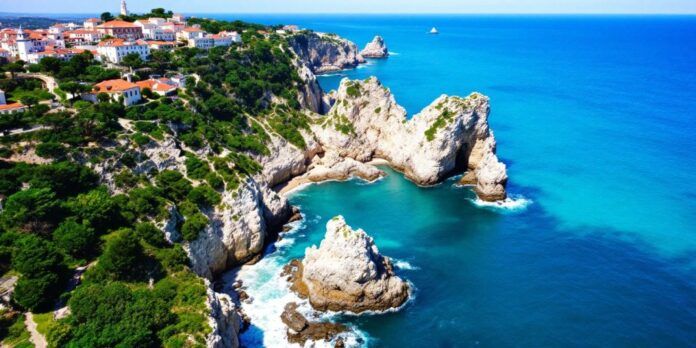 Coastal view of Portugal with cliffs and greenery.