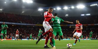 Arsenal players celebrating a goal during the match.