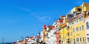 Lisbon cityscape with colorful buildings and clear sky.