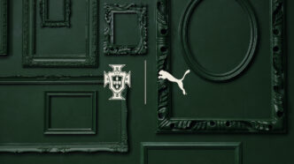 The Portuguese Football Federation logo and the Puma logo superimposed on a large, green antique door