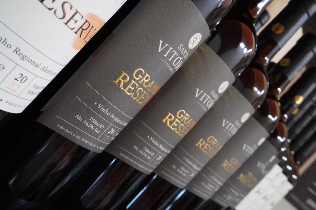 Santa Vitoria Grand Reserva bottles in sharp focus with other bottles in the background