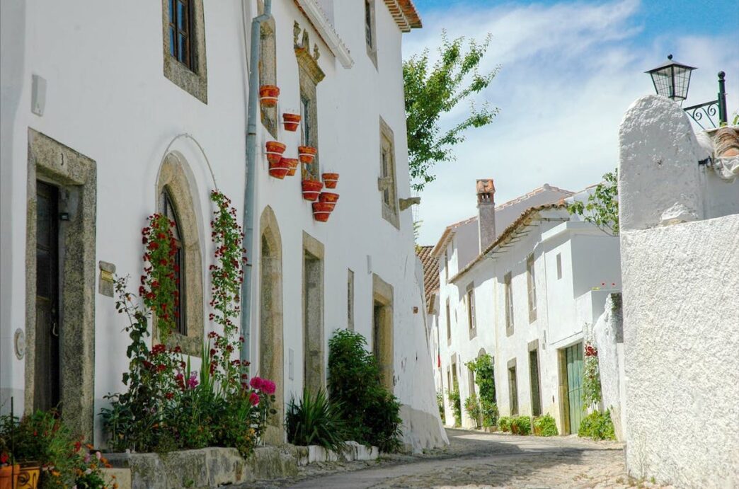 White house on a small street seen in Marvão, Portugal