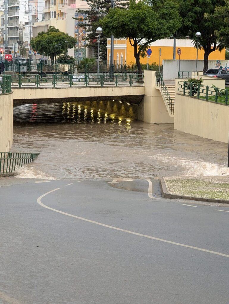 A flooded road running through a tunnel in Olhao, Portugal.