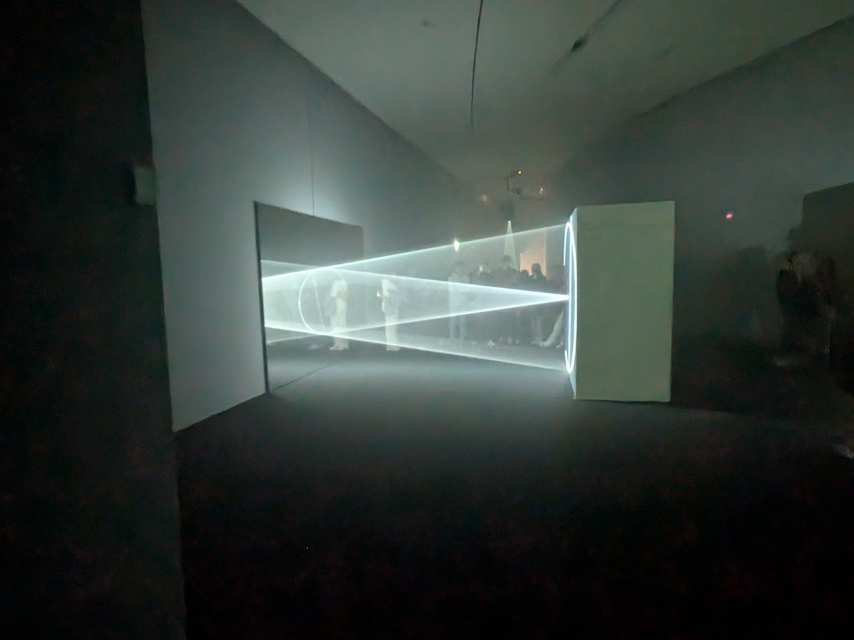 A light sculpture at a darkened art gallery