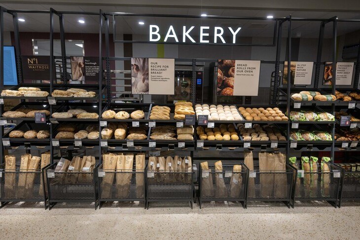 A Waitrose in-stoe bakery with various breads and pastries on display