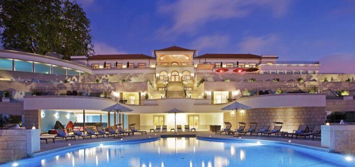 A view of The Yeatman Hotel in the evening with the swimming pool visible in front of teh building.