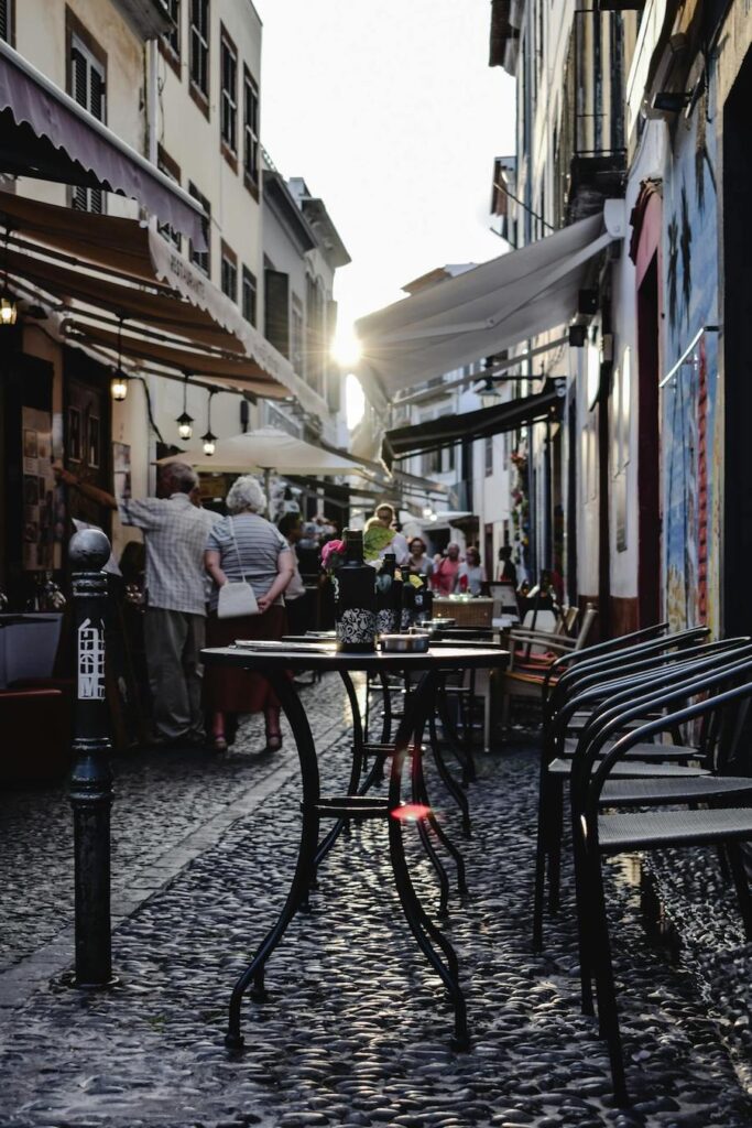 Tables and chairs in an alley way