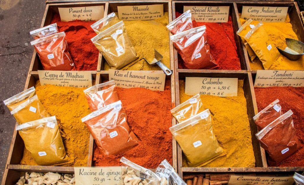 A collection of Indian spices in plastics bags, on a market display