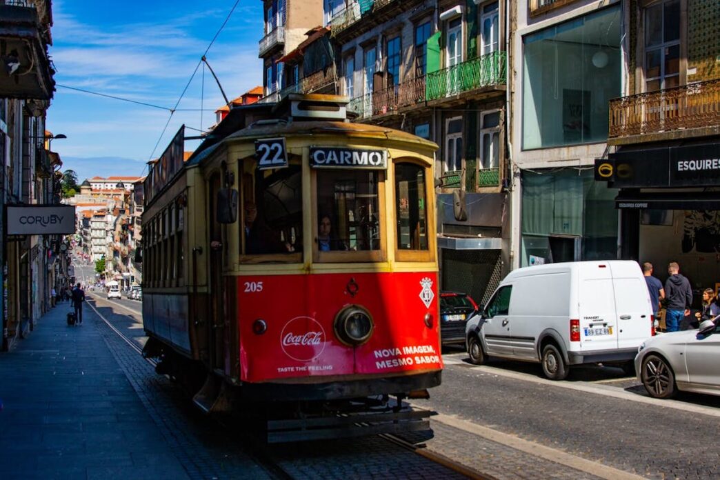 A red tram on a street in Porto, Portugal.