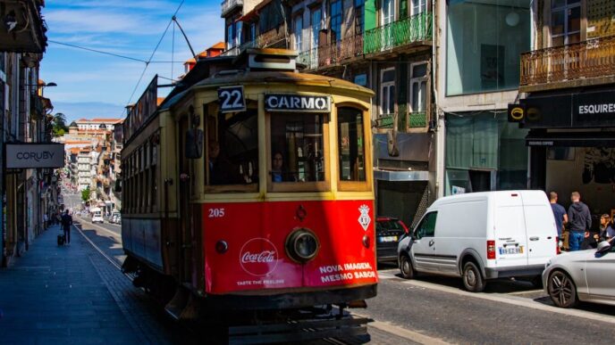 A red tram on a street in Porto, Portugal.