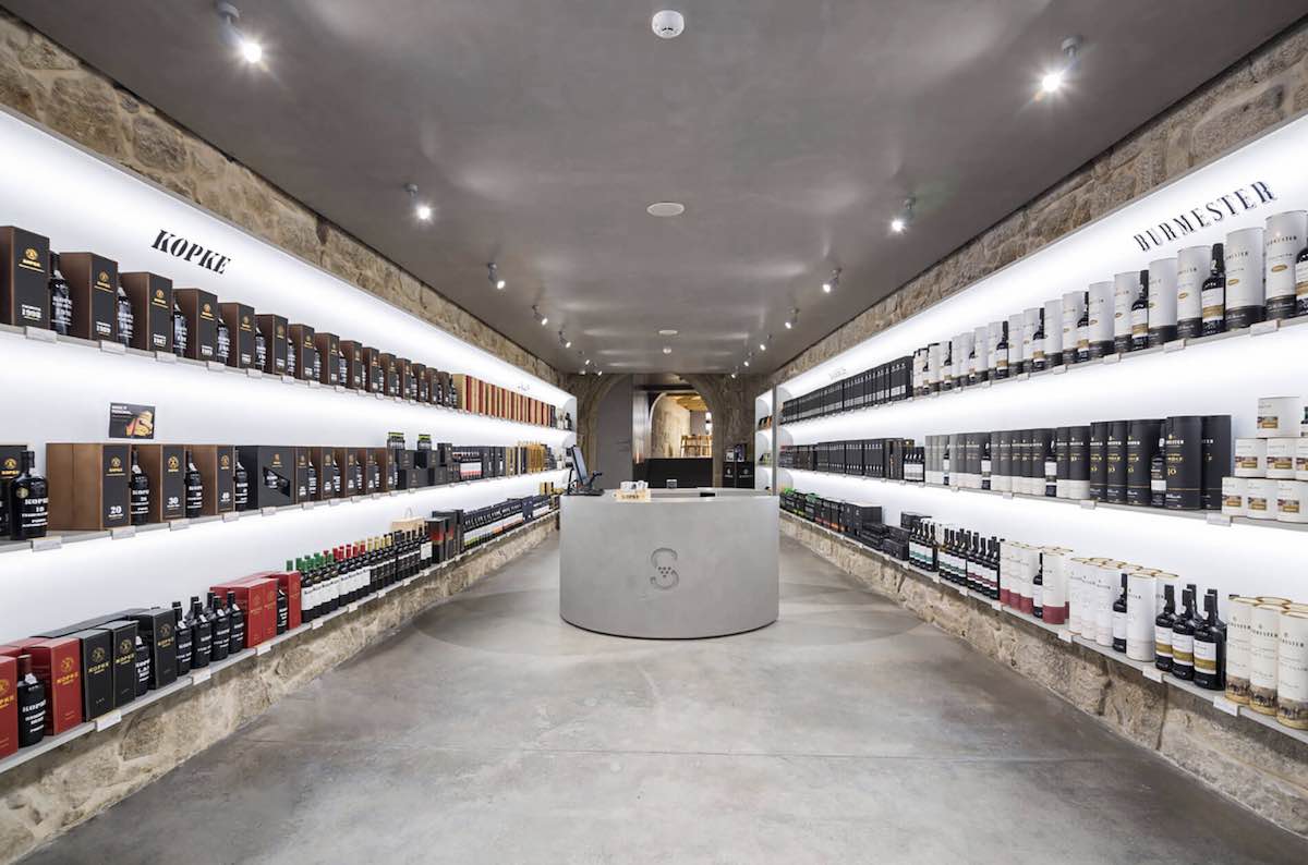 Interior of a Sogevinus shop with shelves filled with wine bottles.