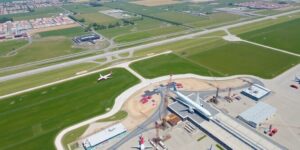 Aerial view of Lisbon Airport with construction activity.