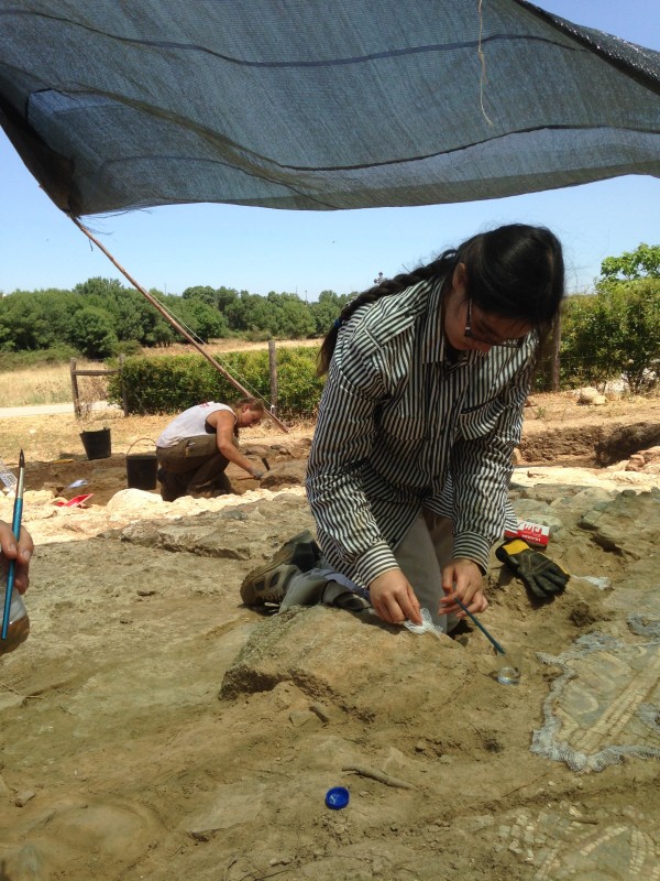 A woman archaelogist works on a dig at the Santa Susana archaeological site.