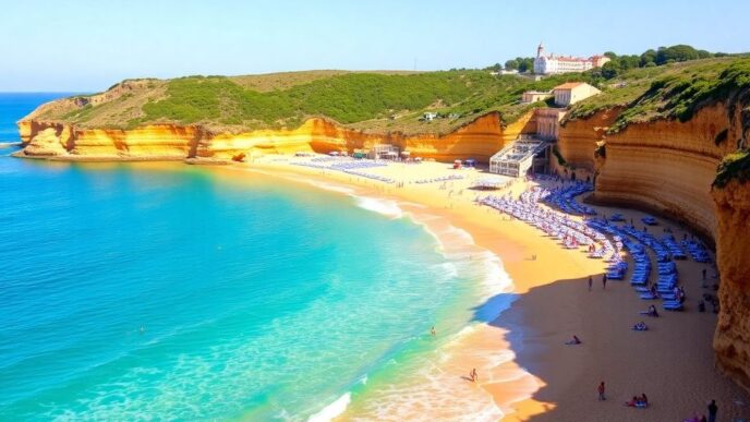 Algarve beach with golden sand and clear blue water.