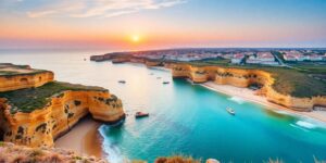 Coastal view of Algarve with cliffs and sunset.