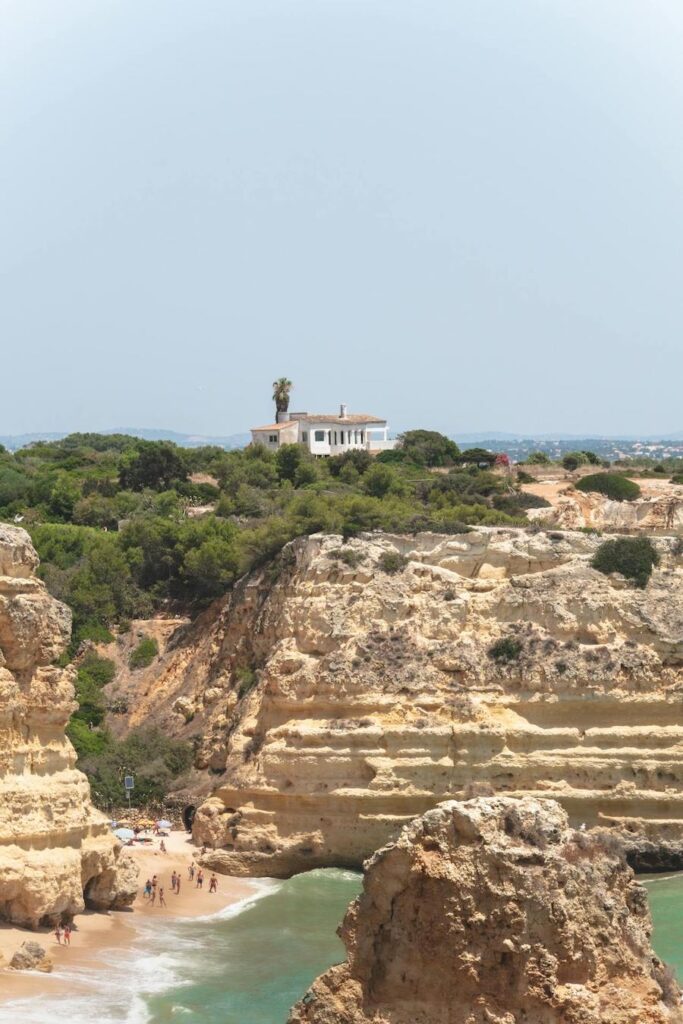 House on Top of Cliffs on a Seashore 