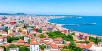 Lisbon skyline with modern buildings and coastal scenery.