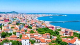 Lisbon skyline with modern buildings and coastal scenery.