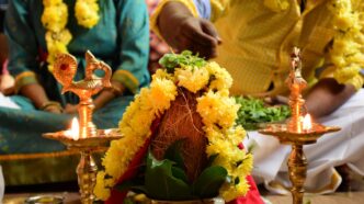 Yellow Flowers Beside a candlestick holder